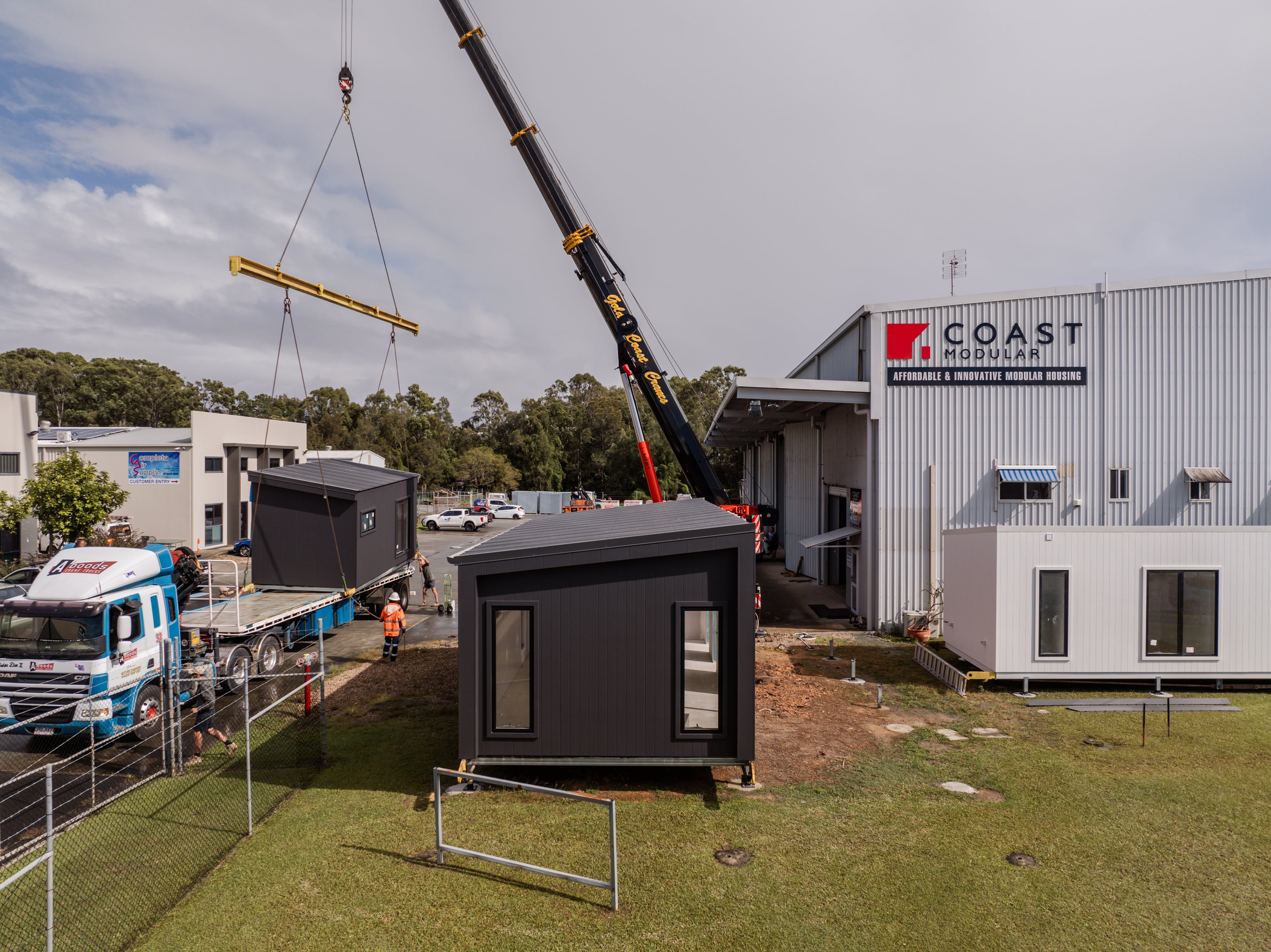 A completed Coast Modular home being craned into position on site