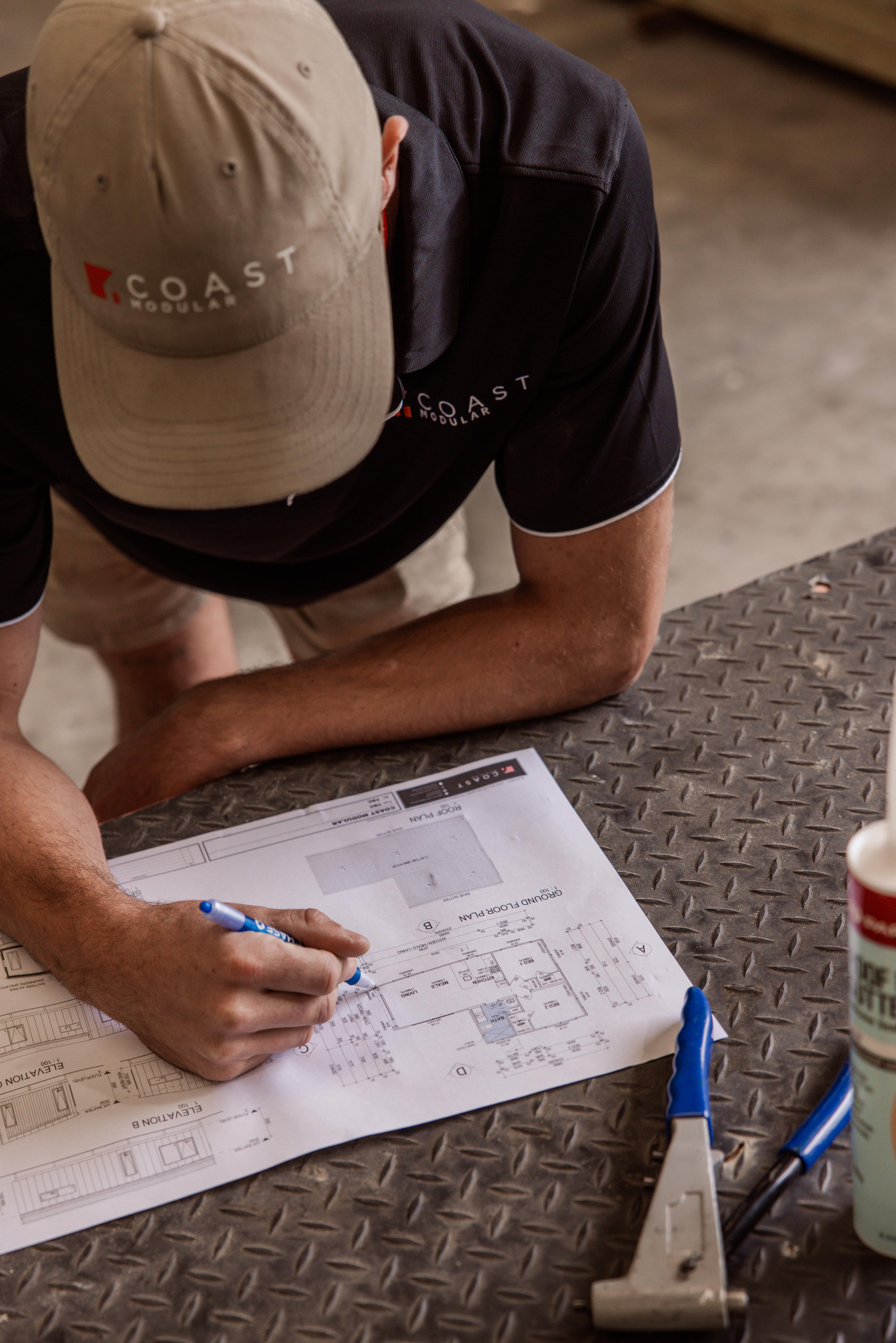 The Coast Modular team going through plans with a customer